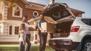 Family unloading boxes from the car