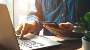 Man on his phone and computer